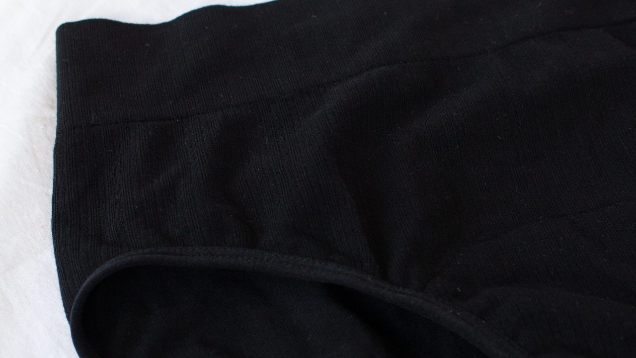 Zoomed in details of POM black bamboo high waisted period underwear