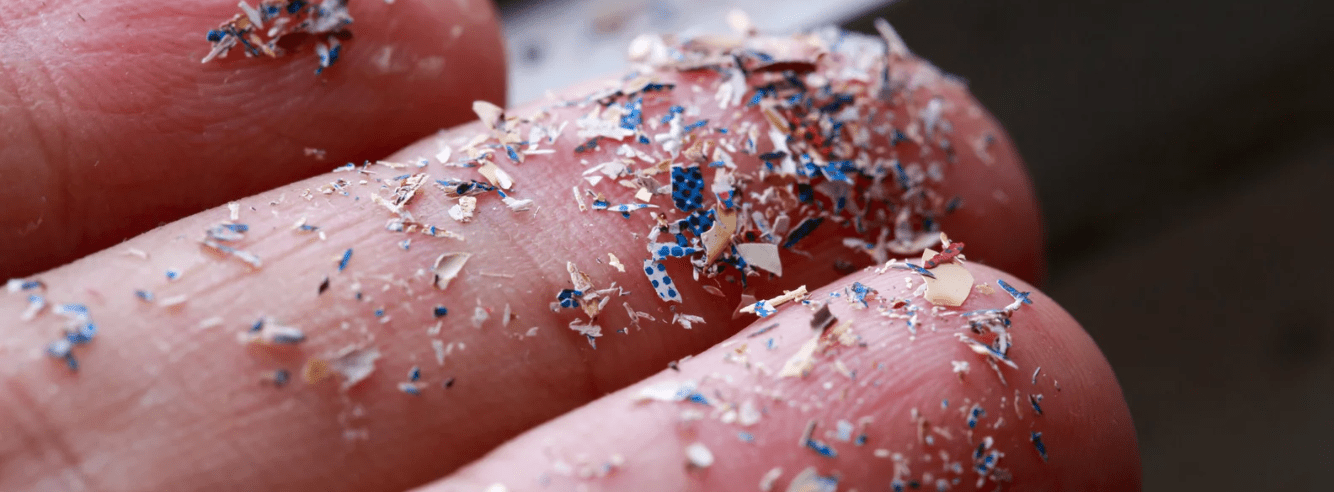 Close up shot of microplastics on finger tips