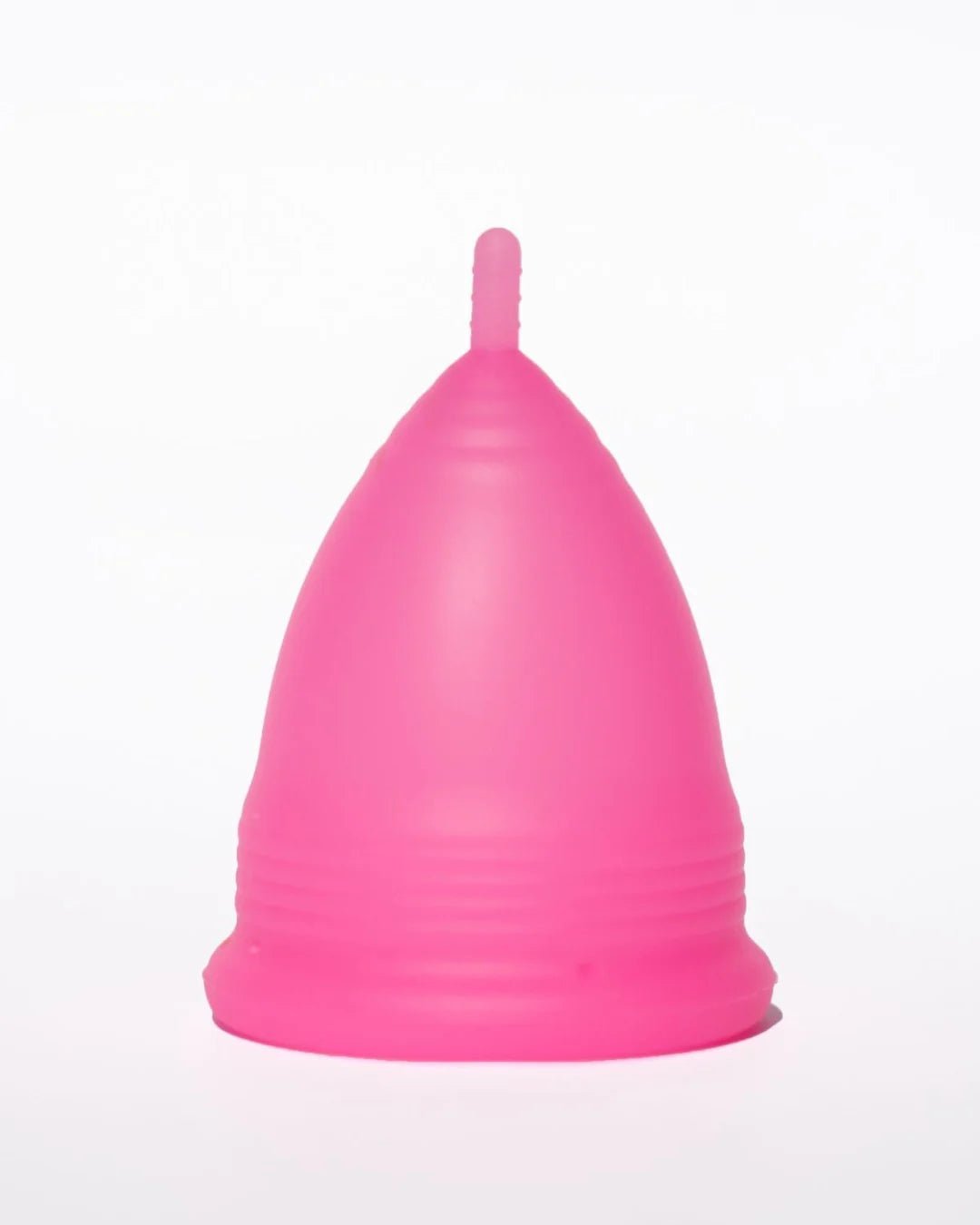 POM Super Soft Menstrual Cup in hot pink, made from 100% medical-grade silicone, featuring ribbed edges and a shorter stem for added comfort.
