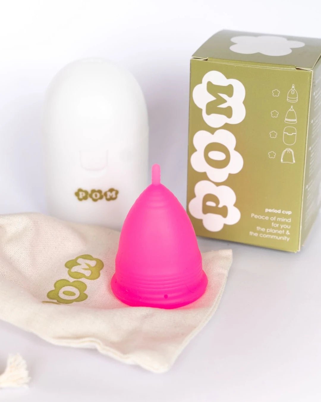 POM Super Soft Menstrual Cup in hot pink, made from 100% medical-grade silicone, featuring ribbed edges and a shorter stem for added comfort.