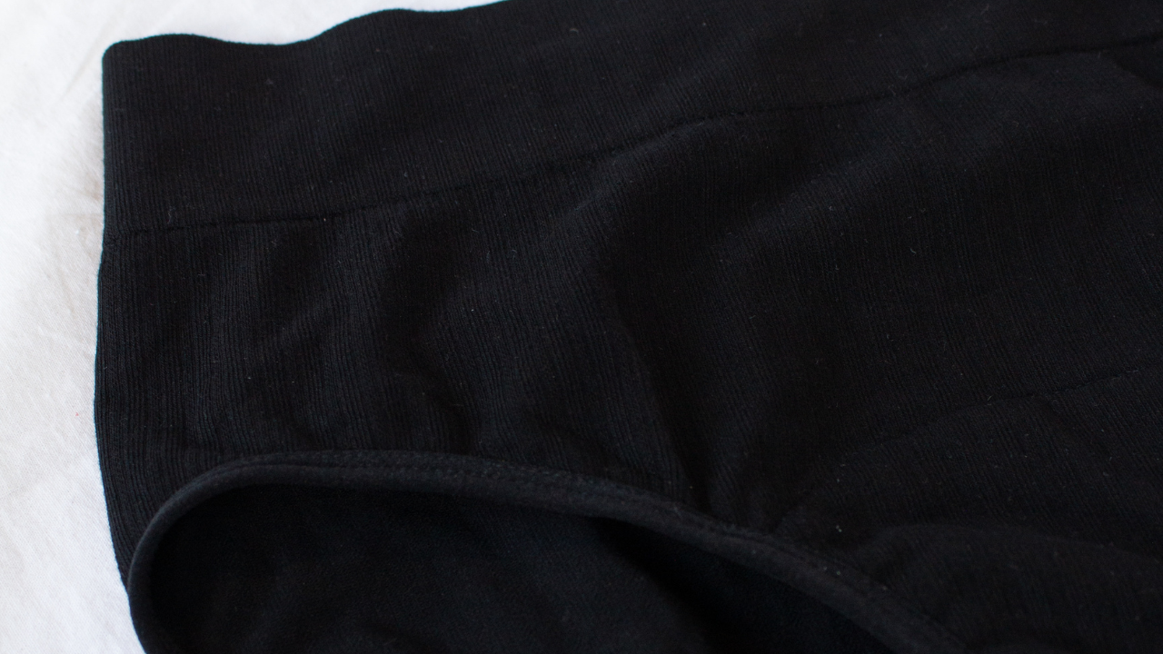 Zoomed in details of POM black bamboo high waisted period underwear 