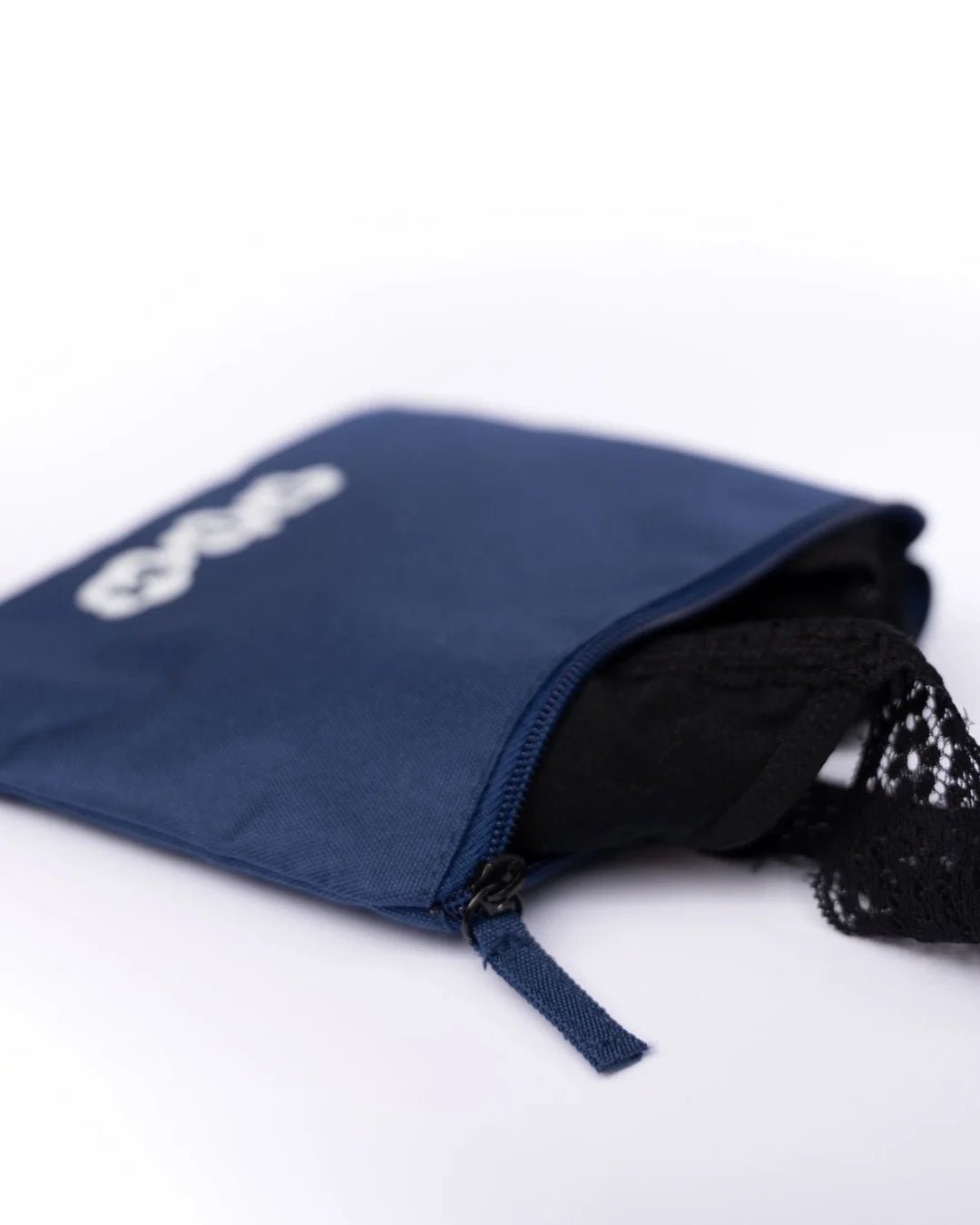 POM Waterproof Toiletry Bag in navy made from rPET (recycled plastic bottles), designed for storing clean or used POM menstrual cups and POM swimwear.